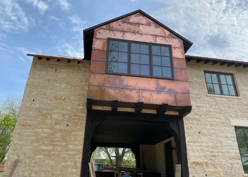 Copper metal panel facade on a stone building for Skylight Installation in North Haledon