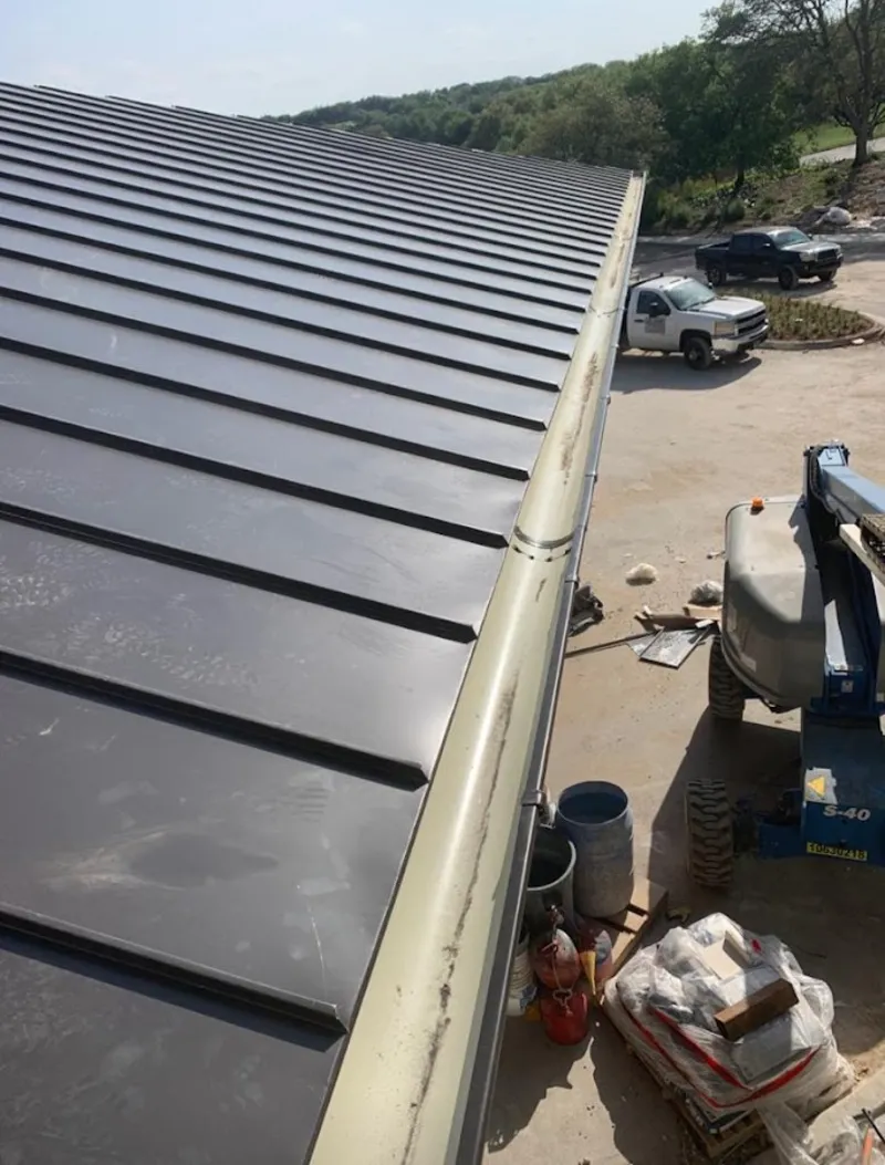 Standing seam panel and gutter detail on a metal roofing jobsite in North Haledon